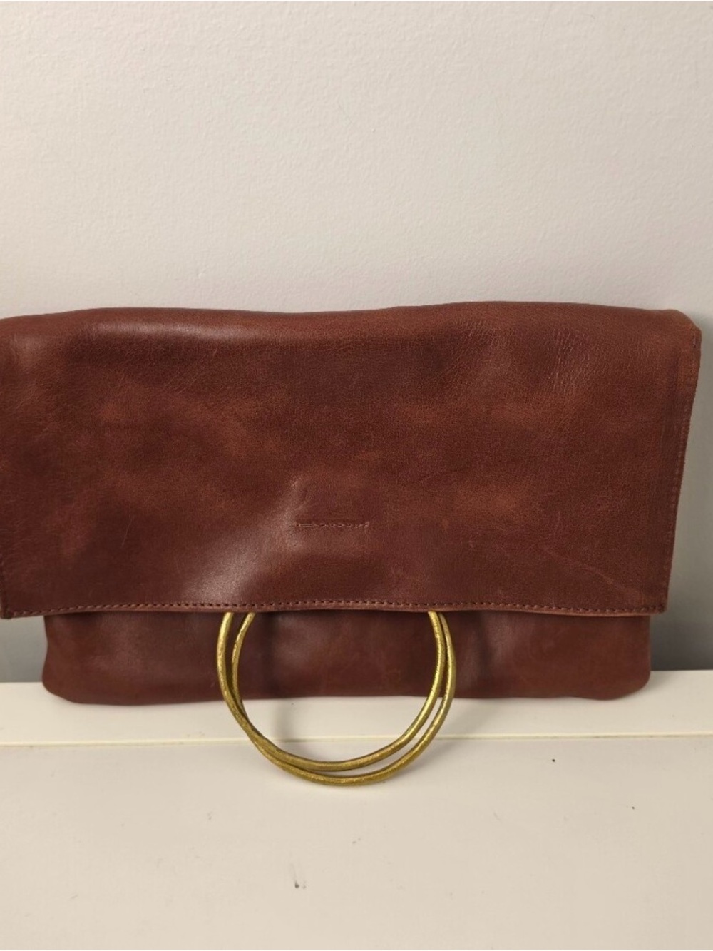 •Parker Clay • Nyala Fold over leather clutch rust